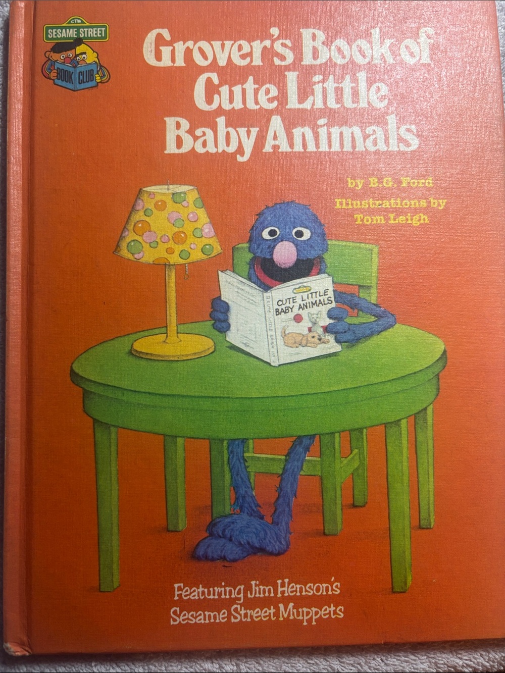 Sesame Street Grover Book with Green Table and Blue Character - Orange Cover